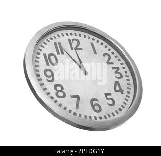 Clock showing five minutes until midnight on white background. New Year countdown Stock Photo