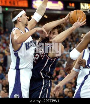 Boston Celtics center Kendrick Perkins, left, battles for a rebound against  New Jersey Nets forward Nenad Krstic, of Serbia and Montenegro, during the  first quarter in Boston, Friday April 14, 2006. (AP