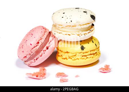 Sweet macaroons macarons isolated on white background. French cookies with vanilla, lemon and strawberry. Pastry shop card Stock Photo