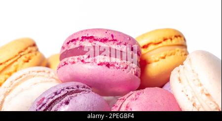 Sweet macaroons macarons isolated on white background. French cookies with vanilla, raspberry, lemon and strawberry. Pastry shop card Stock Photo