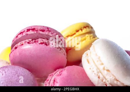 Sweet macaroons macarons isolated on white background. French cookies with vanilla, raspberry, lemon and strawberry. Pastry shop card Stock Photo