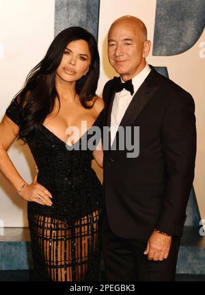 Lauren Sanchez and Jeff Bezos attending the Vanity Fair Oscar Party ...