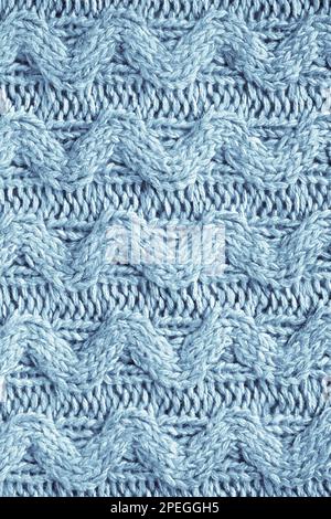 Knit texture of natural soft wool knitted fabric light blue as background Stock Photo