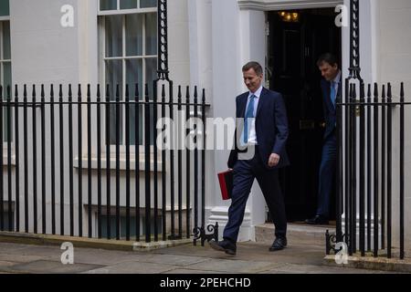 (230316) -- LONDON, March 16, 2023 (Xinhua) -- Chancellor of the Exchequer Jeremy Hunt of the United Kingdom (UK) leaves 11 Downing Street to deliver his budget to Parliament, in London, Britain, on March 15, 2023. UK on Wednesday unveiled a clutch of measures to boost its struggling economy, including childcare reforms, tax cuts for businesses, and policies to ease the cost-of-living burden for households. (Simon Walker/No. 10 Downing Street/Handout via Xinhua) Stock Photo