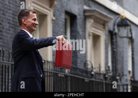 (230316) -- LONDON, March 16, 2023 (Xinhua) -- Chancellor of the Exchequer Jeremy Hunt of the United Kingdom (UK) poses for photographs as he leaves 11 Downing Street to deliver his budget to Parliament, in London, Britain, on March 15, 2023. UK on Wednesday unveiled a clutch of measures to boost its struggling economy, including childcare reforms, tax cuts for businesses, and policies to ease the cost-of-living burden for households. (Rory Arnold/No. 10 Downing Street/Handout via Xinhua) Stock Photo