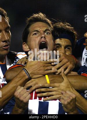 Monterrey's soccer player Guillermo Franco, front, from Argentina head the  ball as Toluca' Carlos Esquivel challenges during the first leg of the  Mexican league championship soccer final at the Nemecio Diez stadium