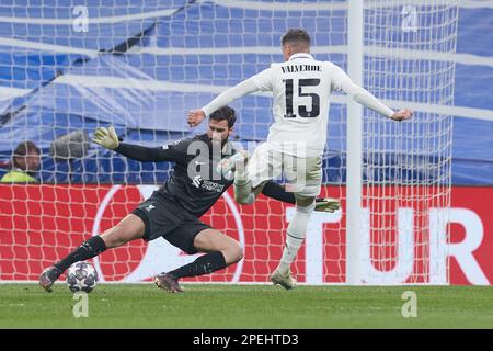 Madrid, Spain. 15th Mar, 2023. Liverpool's Alisson Becker (L) saves the ball during the UEFA Champions League Round of 16 2nd Leg match between Real Madrid and Liverpool FC in Madrid, Spain, on March 15, 2023. Credit: Meng Dingbo/Xinhua/Alamy Live News Stock Photo