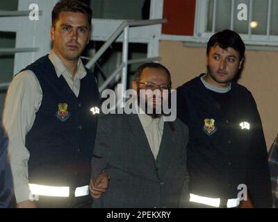 Turkish-born Islamic leader Muhammed Metin Kaplan waves to ...