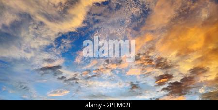 Colorful sky at sunset with clouds in the background Stock Photo
