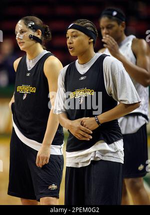 Seattle Storm's Sue Bird, left, and Betty Lennox listen