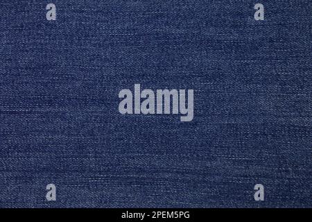 Blue jeans fabric background texture. Blue jeans fabric cloth textile material. Stock Photo