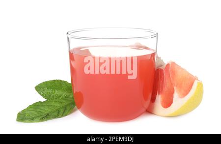 Glass of pink pomelo juice, fruit and green leaves isolated on white Stock Photo