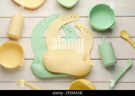 Premium Photo  Baby accessories tableware for food on beige background  silicone dishware serving baby food