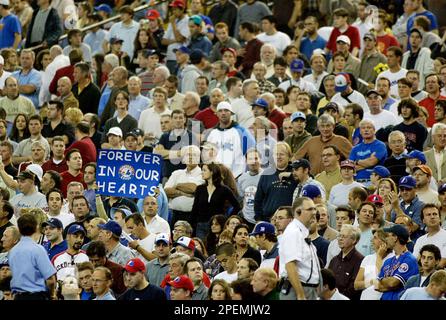 Fans crowd the outfield at Olympic Stadium prior to the Montreal Expos game  against the Florida Marlins in Montreal, Wednesday Sept. 29, 2004.  Wednesday night's game will be the last home game