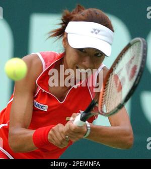 Japan s Shinobu Asagoe returns a backhand to her country fellow