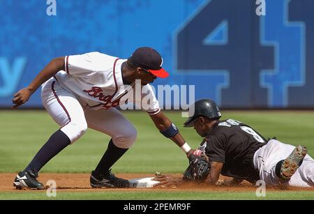 The Florida Marlins' Juan Pierre steals second base as the New York  Yankees' Derek Jeter applies the tag in Game 1 of the World Series at  Yankee Stadium on October 18, 2003.