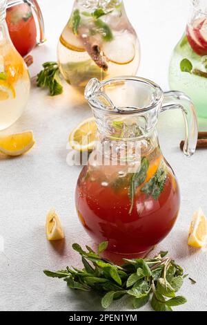 Jars of assorted variety of fresh fruit lemonades Stock Photo