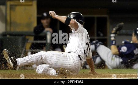 Chicago White Sox's Aaron Rowand drops his bat as he watches his game-tying  two-run homer in the 10th inning against the Detroit Tigers, Saturday,  Sept. 18, 2004, in Chicago. (AP Photo/Jeff Roberson