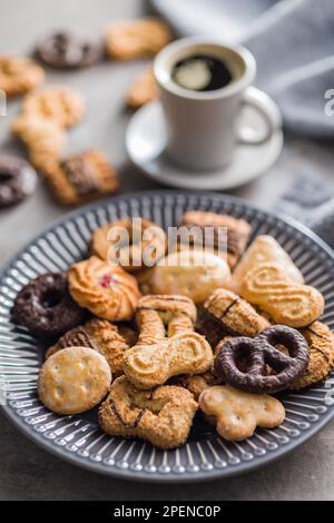Assorted various cookies. Sweet biscuits on the plate. Stock Photo