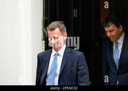 Jeremy Hunt MP (Con: South West Surry) Chancellor of the Exchequer, leaving Downing Street to deliver his first budget, 15th March 2023 followed by Jo Stock Photo