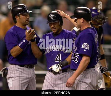 Colorado Rockies' Vinny Castilla, right, is congratulated by