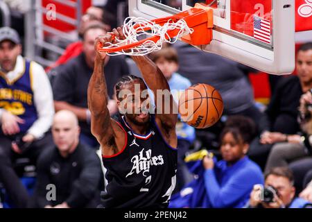 Los Angeles, United States. 15th Mar, 2023. Los Angeles Clippers forward Kawhi Leonard dunks against the Golden State Warriors during an NBA basketball game at Crypto.com Arena in Los Angeles. Credit: SOPA Images Limited/Alamy Live News Stock Photo