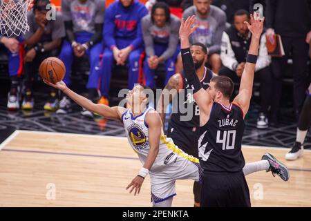 Golden State Warriors guard Jordan Poole (L) goes to the basket next to Los Angeles Clippers center Ivica Zubac (R) during an NBA basketball game at Crypto.com Arena in Los Angeles. (Photo by Ringo Chiu / SOPA Images/Sipa USA) Stock Photo