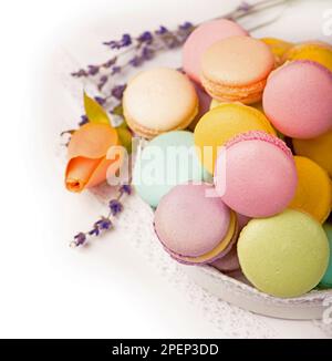 Colorful macaroons in a gift box on a white table Stock Photo
