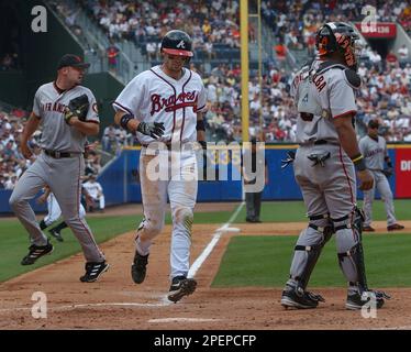 Atlanta Braves' Eli Marrero, center, Chipper Jones, left, and