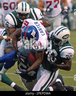 Washington Redskins Clinton Portis (26) breaks the tackle of New York Jets  Victor Hobson (54) in the first quarter at Giants Stadium in East  Rutherford, New Jersey on November 4, 2007. The