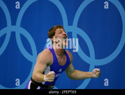 Khadjimourad Akkaev of Russia pumps his fists after lifting 485 lbs