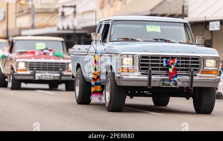 Brownsville, Texas, USA - February 26, 2022: Charro Days Grand International Parade, a group of Classic Ford trucks part of the parade Stock Photo