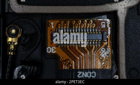 A close-up image of a circuit board with various colored wires and buttons Stock Photo