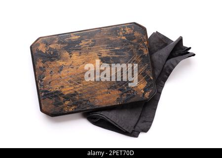 Wooden cutting board and kitchen towel. Isolated on white background. Flat lay with copy space Stock Photo