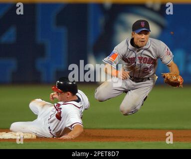 Atlanta Braves' Eli Marrero, center, Chipper Jones, left, and