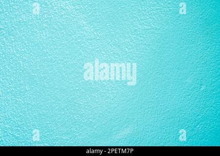 Concrete abstract wall of light cyan color, cement texture background for design. Stock Photo