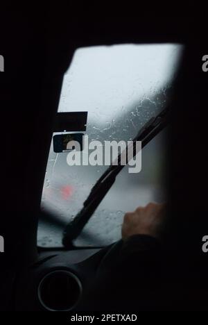 View on rainy weather through car window Stock Photo