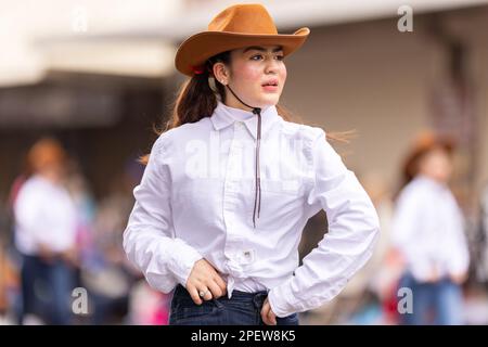 Brownsville, Texas, USA - February 26, 2022: Charro Days Grand International Parade, dancers dress up as cowgirls performing at the parade Stock Photo