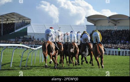 Race 4 The Unibet Champion Hurdle.   Horses on the first circuit    Racing at Cheltenham Racecourse on Day 1 of The Festival, the celebration of Natio Stock Photo