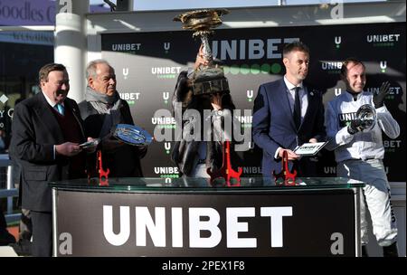 Race 4 The Unibet Champion Hurdle.   Race winner Constitution Hill ridden by Nico de Boinville. Winning connections at the winners presentation    Rac Stock Photo