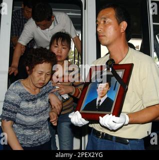 Kim Jong-kyu, left, and Shin Young-ja, parents of Kim Sun-il who was ...