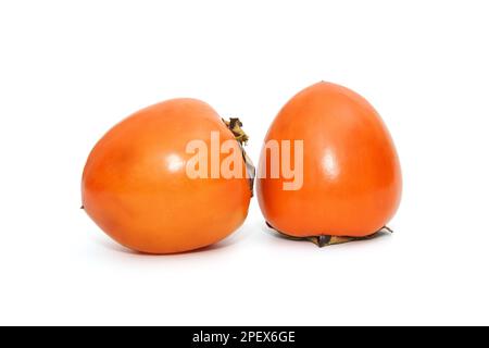 Two ripe persimmons isolated on a white background Stock Photo