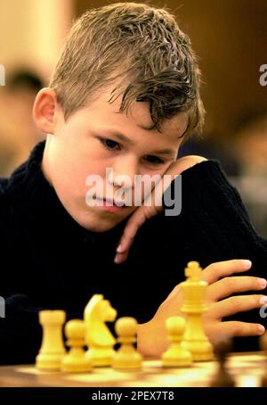 Magnus Carlsen, the Norwegian chess player who came to international  attention after winning the C group of the Corus Chess Tournament in  January 2004 at the age of thirteen, plays against Armenian