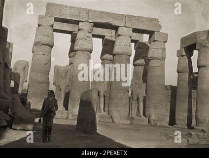 circa 1940s, historical, a gentleman walking at the ancient ruins of the Temple of Karnak, Luxor, Egypt. Stock Photo