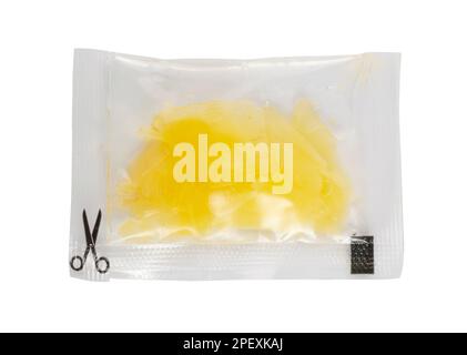 Pickled Ginger in Square Plastic Bag Isolated, One-Time Portion of White Pickled Gari, Marinated Ginger Slices Transparent Sachet on White Background Stock Photo