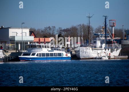 16 March 2023, Mecklenburg-Western Pomerania, Peenemünde: Ships are moored in the port of Peenemünde in sunny weather. According to the weather service, the weather will remain unsettled in the next few days with rising temperatures. Photo: Stefan Sauer/dpa Stock Photo