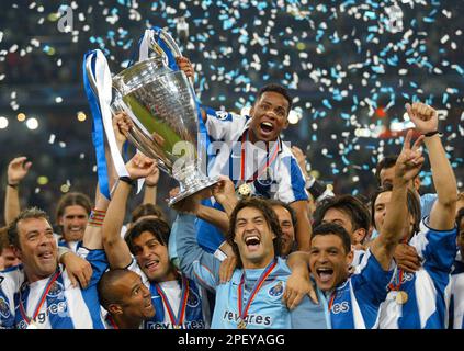 Porto players celebrate as they lift the trophy after beating