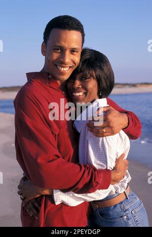 Romantic african-American couple having fun in the summertime on the beach Stock Photo