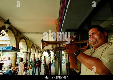 Blind trumpet player Jose Vazquez performs Wednesday, May 19, 2004, in Guadalajara, Mexico. On May 28 and 29, the city of Guadalajara will be hosting the 3rd Latin American and the Caribbean-European Union Summit. (AP Photo/Guillermo Arias)