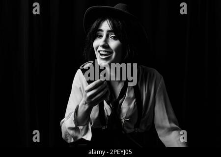 A grayscale of an energetic Caucasian young female singing with studio ...